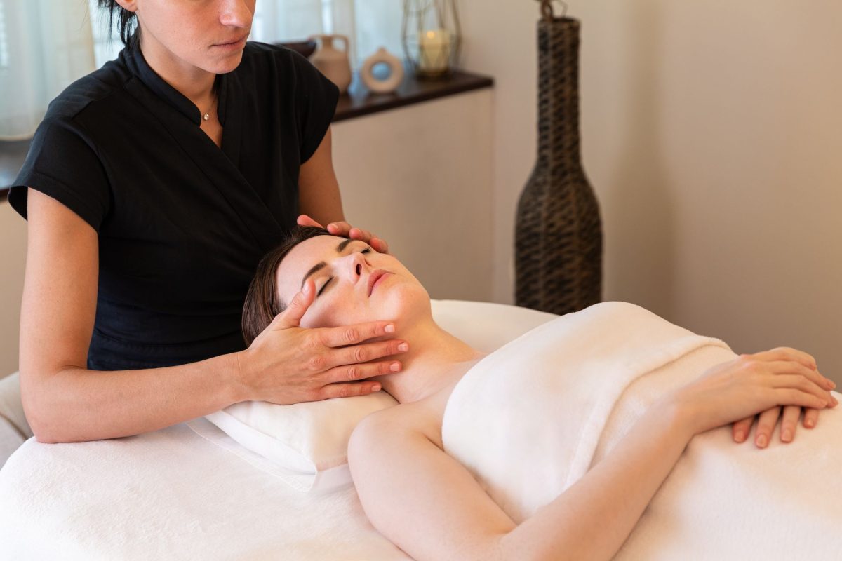A woman receiving a facial treatment at the InterContinental Genève spa.